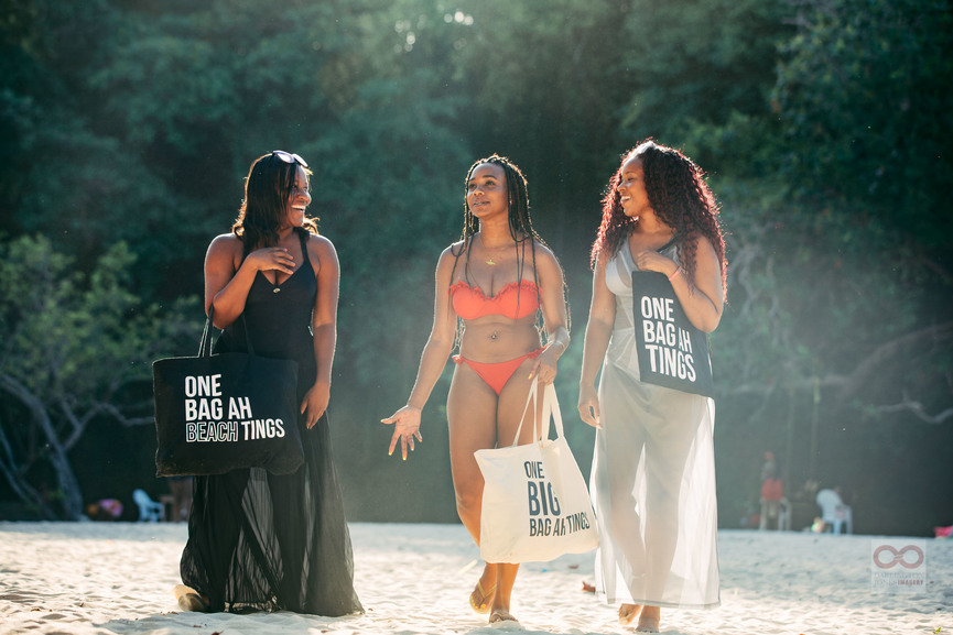 Jamaican women walking on beach