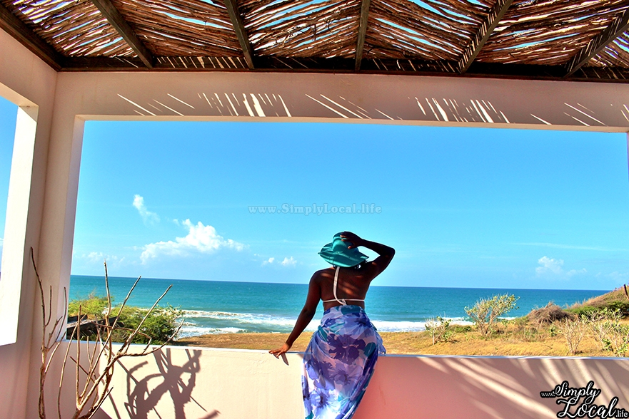 Turtles Nest Treasure Beach Jamaica Villa woman with hat by the beach